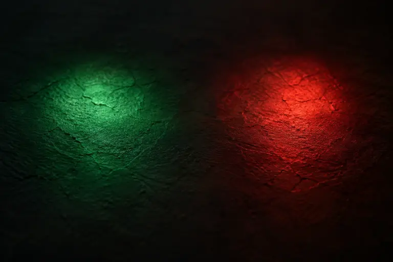 Conceptual red and green light on a textured surface